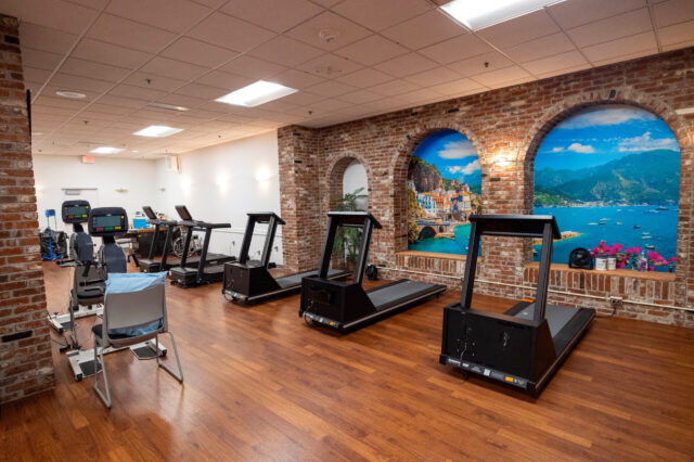 UF Health Cardiac Rehabilitation – Jacksonville facility interior with treadmills and exercise bikes.