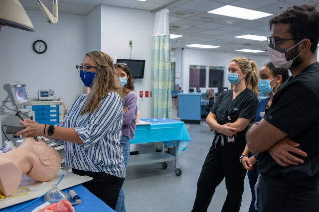 Resident physicians train on intubation in the UF Sim Center.