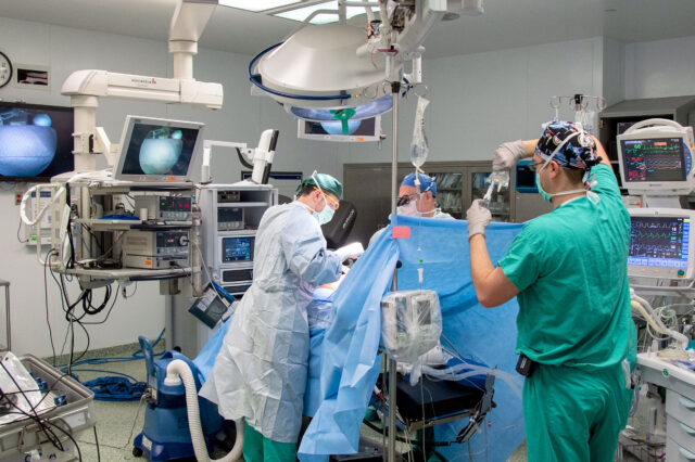 Anesthesiologist monitors a patient during surgery