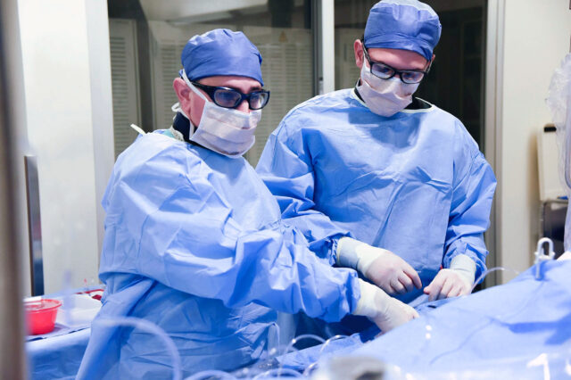 UF Health cardiologists performing an interventional procedure in UF Health Jacksonville cath lab.