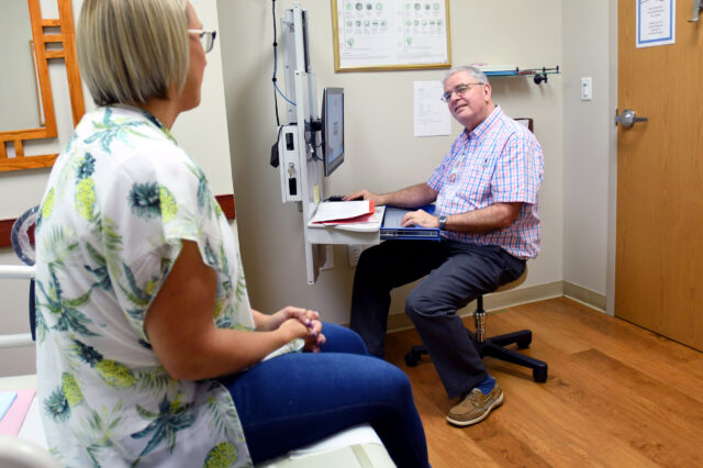 UF Health obstetrician-gynecologist meets with patient