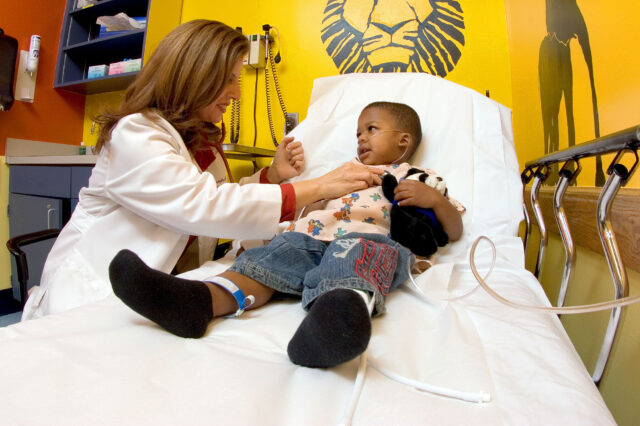 Dr. Madeline Joseph with pediatric patient at UF Health Pediatric Emergency Center