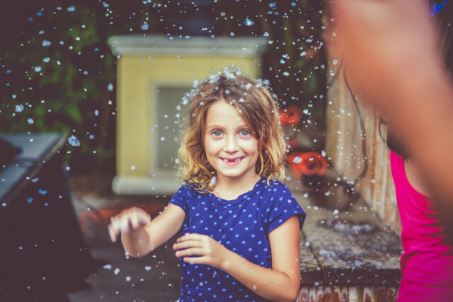 Young girl with snowflakes in her hair