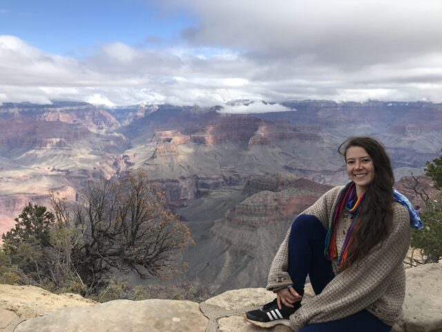 Ashley Durand stops for a photo opportunity while visiting a national park.
